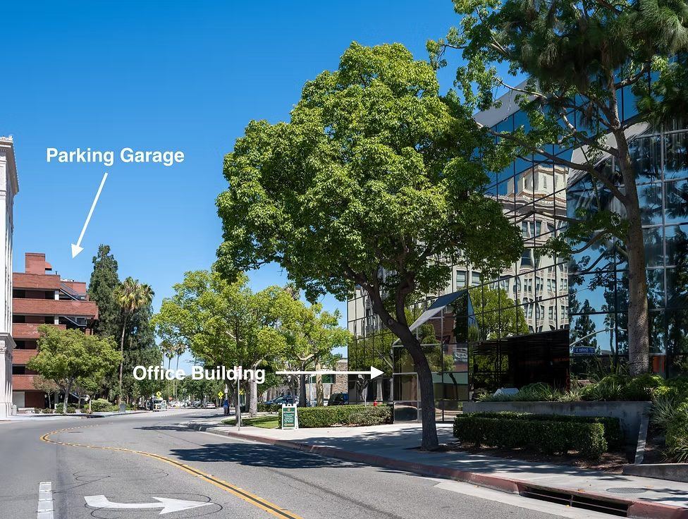 Street view showing the parking garage and the office building