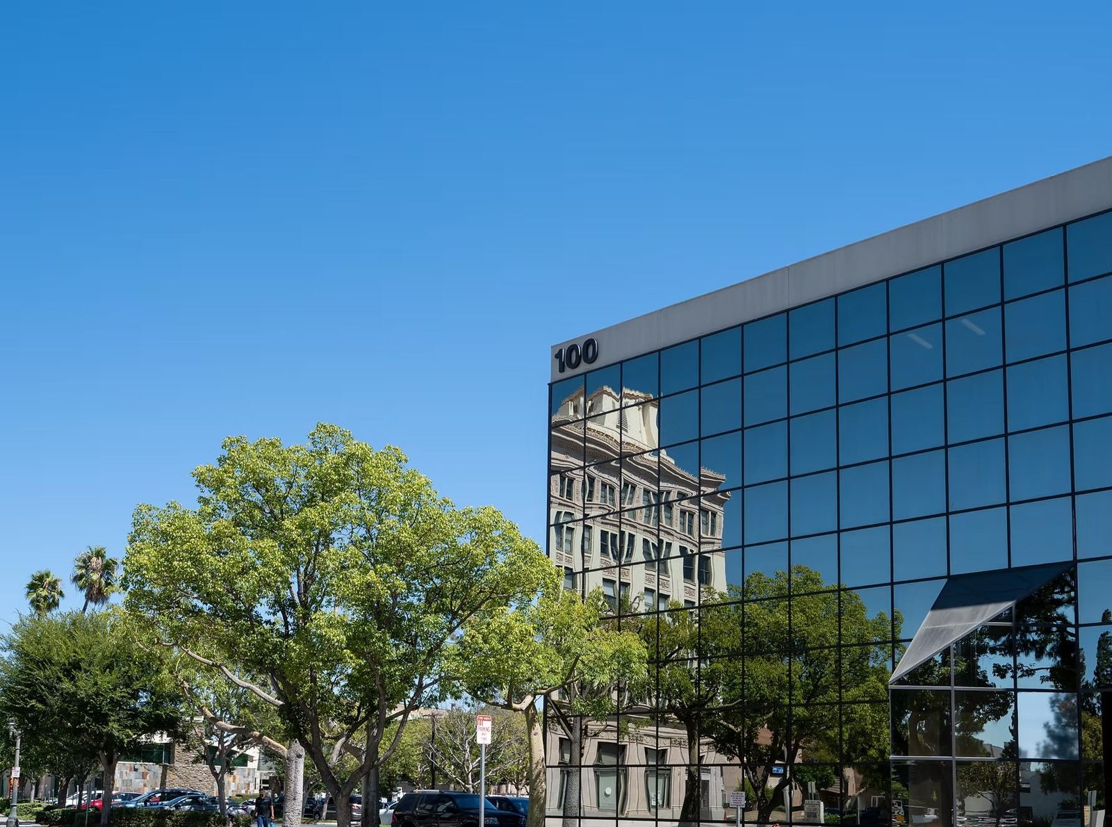 The glass office tower at 100 S Anaheim Blvd